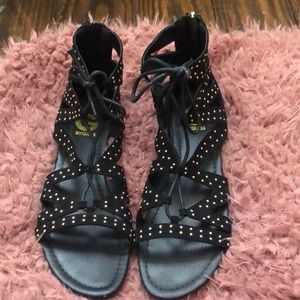 Black sandals with gold studs